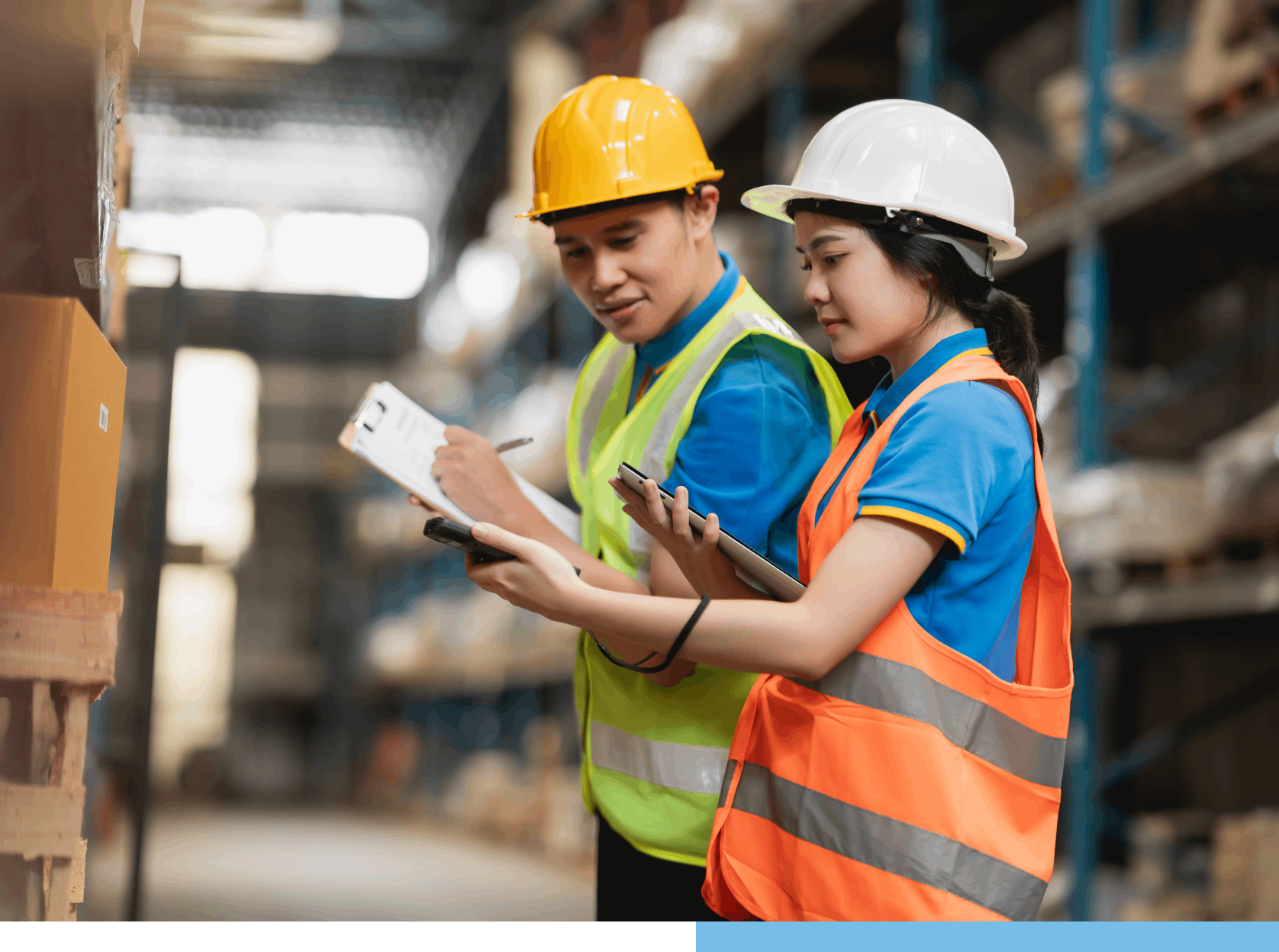 Group 3(1) Warehouse workers in safety vests and helmets.